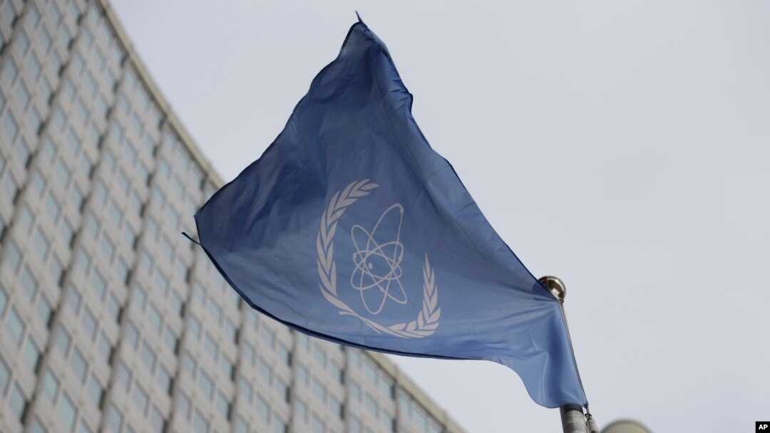 FILE - The flag of the International Atomic Energy Agency flies in front of its headquarters during an IAEA Board of Governors meeting in Vienna, Austria, on Feb. 6, 2023. 