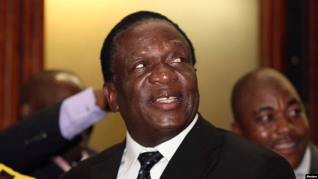 Newly appointed Zimbabwean Deputy President Emmerson Mnangagwa smiles at the headquarters of ZANU (PF) in Harare, Dec.10, 2014. 