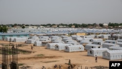 FILE - A tent city for people internally displaced by Boko Haram violence is seen at the unfinished Mohammed Goni Stadium in Maiduguri, Nigeria, July 26, 2019.