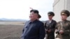 FILE - North Korean leader Kim Jong Un, accompanied by military officials, observes a Korean People's Air Force training flight at undisclosed location in this April 16, 2019, photo released April 17, 2019 by North Korea's Central News Agency (KCNA).