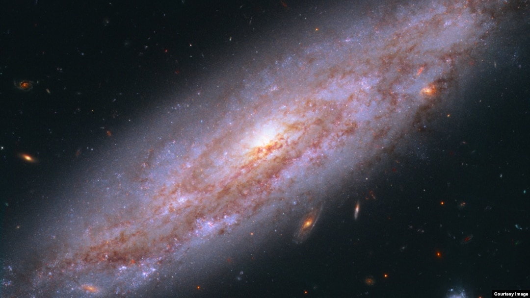 Hubble's view of a galaxy in Ursa Major, 65 million light-years away. (NASA, ESA, A. Riess (STScI/JHU)