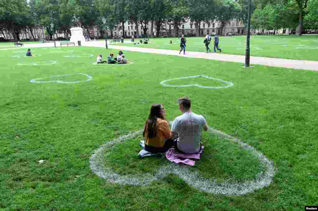 Hearts painted by a team of artists from Upfest are seen in the grass at Queen Square, following the coronavirus disease (COVID-19) outbreak, in Bristol, Britain.
