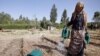 Woman waters seedlings in the Lake Tana area of Ethiopia’s Amhara Region. ©IFAD/Petterik Wiggers