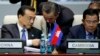 Chinese Premier Li Keqiang, left, talks with Foreign Minister Wang Yi, center, as he and Cambodia's Prime Minister Hun Sen, right, attend the opening session of the Asia-Europe Meeting summit in Ulaanbaatar, Mongolia, July 15, 2016. 