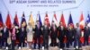 ASEAN leaders and delegates pose for a photo during a working lunch on the sidelines of the 33rd ASEAN summit in Singapore, Wednesday, Nov. 14, 2018. 