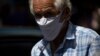 A man wears a homemade face mask as a preventive measure against the spread of the new coronavirus in Caracas, Venezuela, March 26, 2020.
