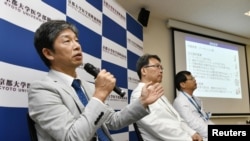 Jun Takahashi, left, professor at Kyoto University's Centre for iPS Cell Research and Application, attends a news conference in Kyoto, Japan, July 30, 2018. 