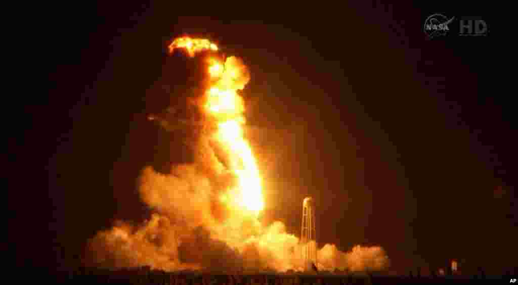 This image taken from video provided by NASA TV shows Orbital Sciences Corp.'s unmanned rocket blowing up over the launch complex at Wallops Island, Va., just six seconds after liftoff. The company says no one was believed to be hurt and the damage appeared to be limited to the facilities, Oct. 28, 2014.