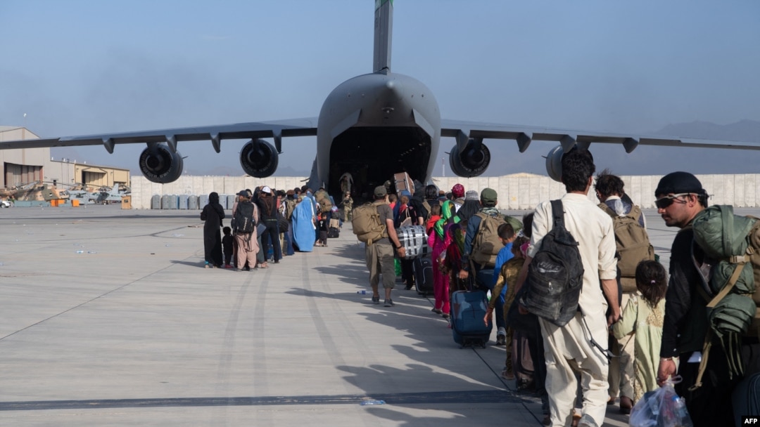 FILE - Passengers board a US Air Force C-17 Globemaster III at Hamid Karzai International Airport, Afghanistan, Aug. 24, 2021. (US Air Force Photo)