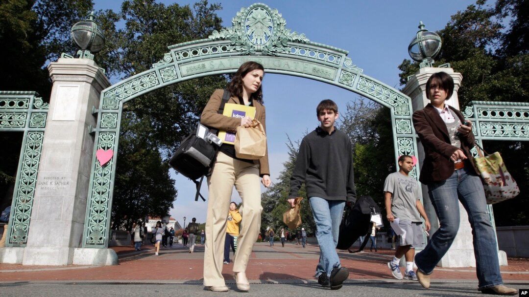 FILE - In this Dec. 14, 2011, photo, University of California Berkeley students walk through Sather Gate on the campus in Berkeley, California. 