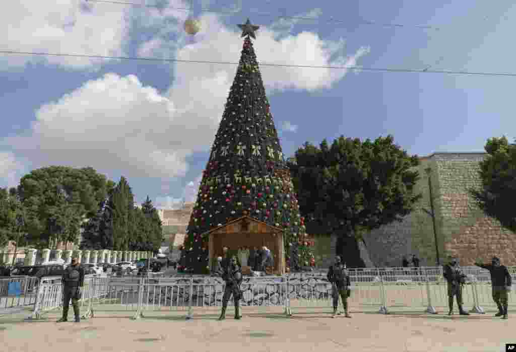 A Palestinian National security unit is deployed in Manger Square, adjacent to the Church of the Nativity, traditionally believed by Christians to be the birthplace of Jesus Christ, ahead of Christmas, in the West Bank city of Bethlehem, Dec. 23, 2020.