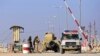 A military ambulance crosses from the Syrian side of the border to Iraq in Qaim, Anbar province, Iraq, Nov.13, 2018. 
