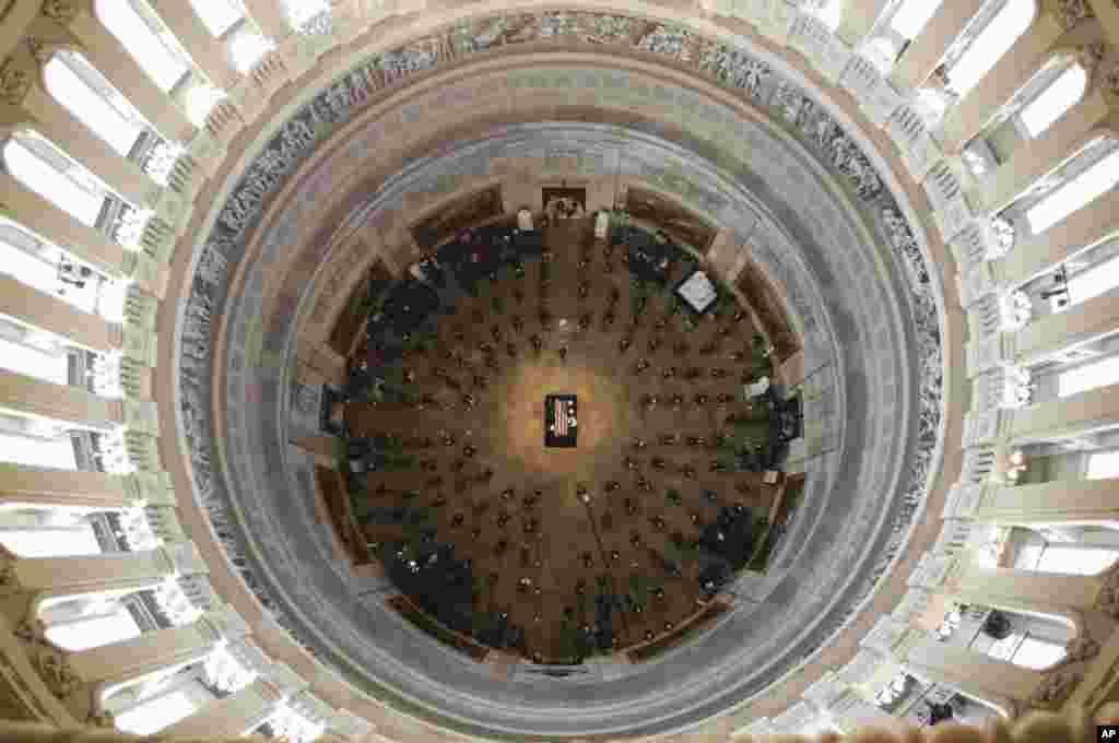 The flag-draped casket of civil rights pioneer Rep. John Lewis, D-Ga., is placed by a U.S. military honor guard at the center of the U.S. Capitol Rotunda to lie in state in Washington, D.C., July 27, 2020.