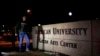 FILE - Students walk through the American University campus in Washington, December 11, 2013.