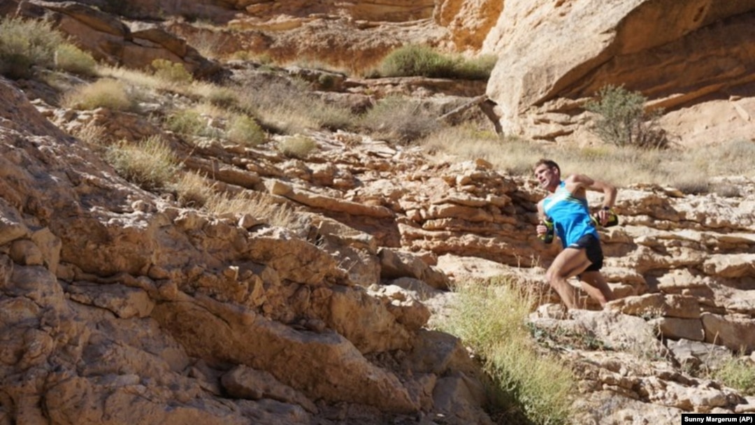 Professional trail runner Tim Freriks running to break the single crossing record. (Sunny Margerum/HOKA One One via AP)