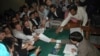 Pakistan's former prime minister Nawaz Sharif (C) submits his nomination papers for the upcoming by-elections in Lahore May 13, 2008. Pakistani prime minister Yousuf Raza Gilani called for a last-ditch effort to save his government on Tuesday, after refus