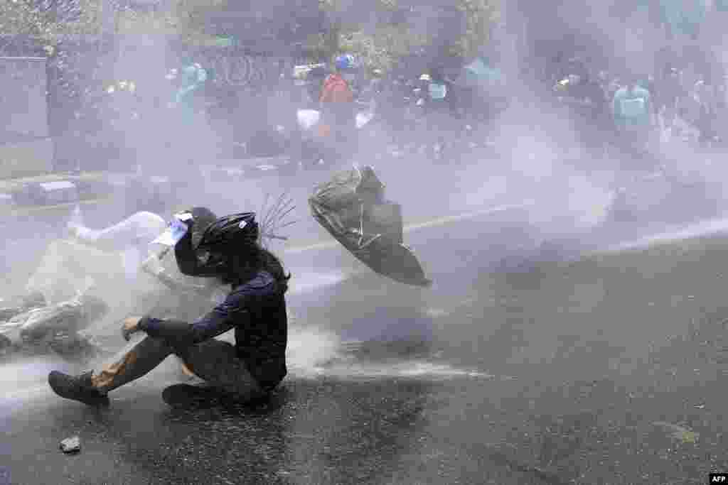 Police use water cannon to disperse demonstrators protesting against the government’s policy on the fight against the COVID-19 situation, in Kathmandu, Nepal.