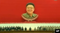 FILE - North Korean leader Kim Jong Un, center, attends an event to mark the second anniversary of the death of his father, former leader Kim Jong Il.