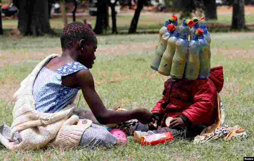 A child wears plastic bottle waste provided by climate change and environmental activists as they protest marking a global climate action day under the theme ''#AfricaIsNotADumpster'' at the Uhuru Park's Freedom Corner in Nairobi, Kenya.