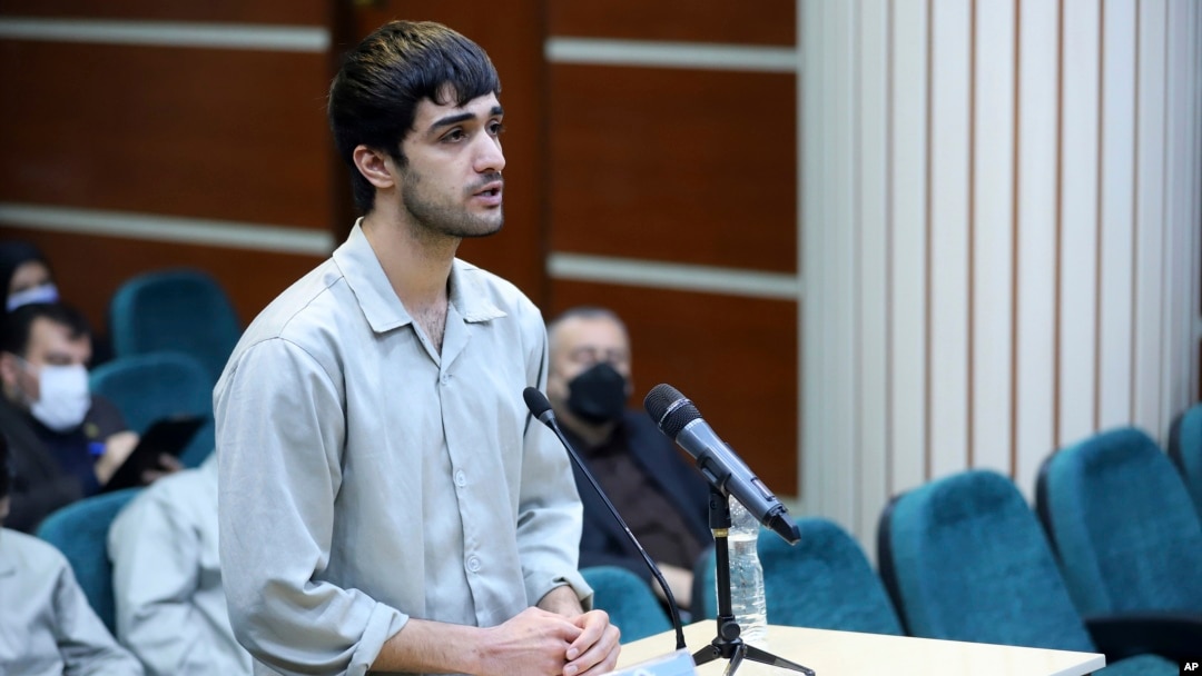 In this photo released by Mizan News Agency, Mohammad Mehdi Karami, a protester convicted and executed, speaks during his trial at the Revolutionary Court, in the city of Karaj, Iran, on Nov. 30, 2022. Iran said it executed Karami on Jan. 7, 2023.