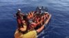 MIGRANTS AT SEA