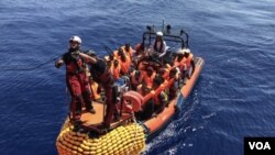 MIGRANTS AT SEA