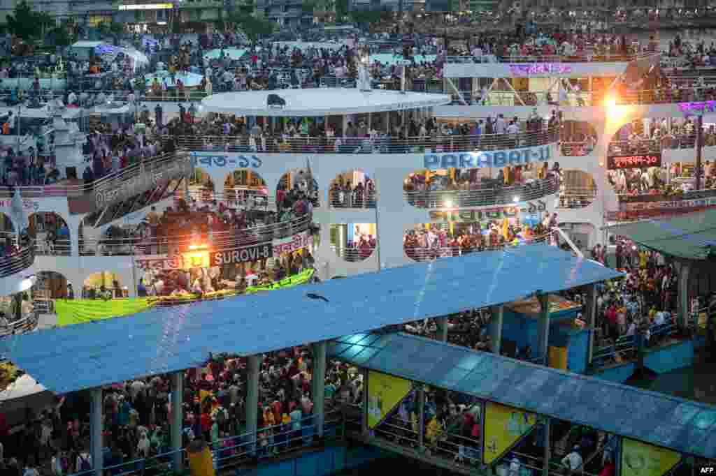 People travel back home ahead of the Muslim festival Eid al-Adha or the 'Festival of Sacrifice' in Dhaka, Bangladesh.