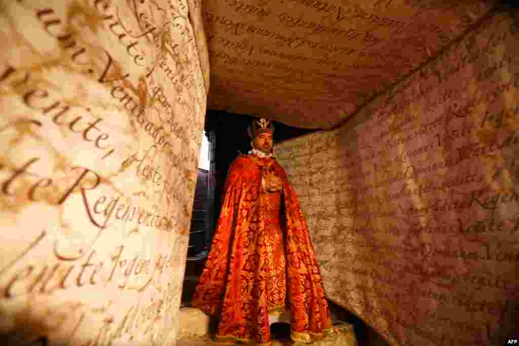 An Armenian priest enters the Nativity Grotto, thought to be the cave in which Jesus was born, during the first Sunday Mass at the Church of the Nativity after its reopening, as Palestinian authorities eased coronavirus restrictions, in the occupied West Bank town of Bethlehem.