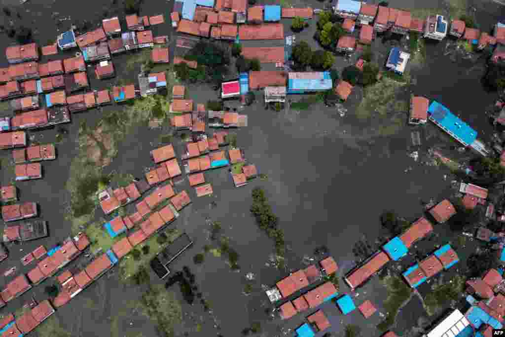 An aerial view shows flooded residential buildings due to rising water levels of the Yangtze river in Jiujiang, China's central Jiangxi province, July 18, 2020.