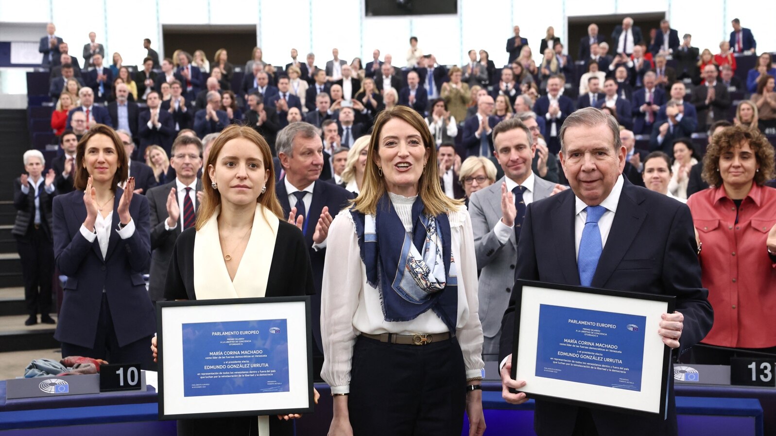Venezuelan opposition presidential candidate Edmundo Gonzalez Urrutia and Ana Corina Sosa pose next to European Parliament President Roberta Metsola after during an award ceremony at in Strasbourg, Dec. 17, 2024.