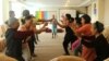 Participants react at a Parents, Families and Friends of Lesbians and Gays meeting in Vietnam.