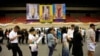 People line up for their early vote for the upcoming Thai election at a polling station in Bangkok, Thailand, March 17, 2019. 