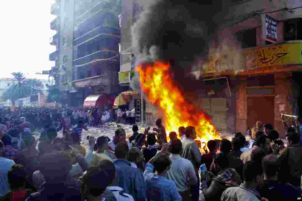 Protesters storm an office of Egyptian President Mohamed Morsi's Muslim Brotherhood Freedom and Justice party and set fires in the Mediterranean port city of Alexandria, Egypt, Nov. 23, 2012.