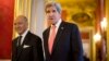 U.S. Secretary of State John Kerry, right, walks to a meeting with France's Foreign Minister Laurent Fabius at the Quai d' Orsay in Paris, March 27, 2013.