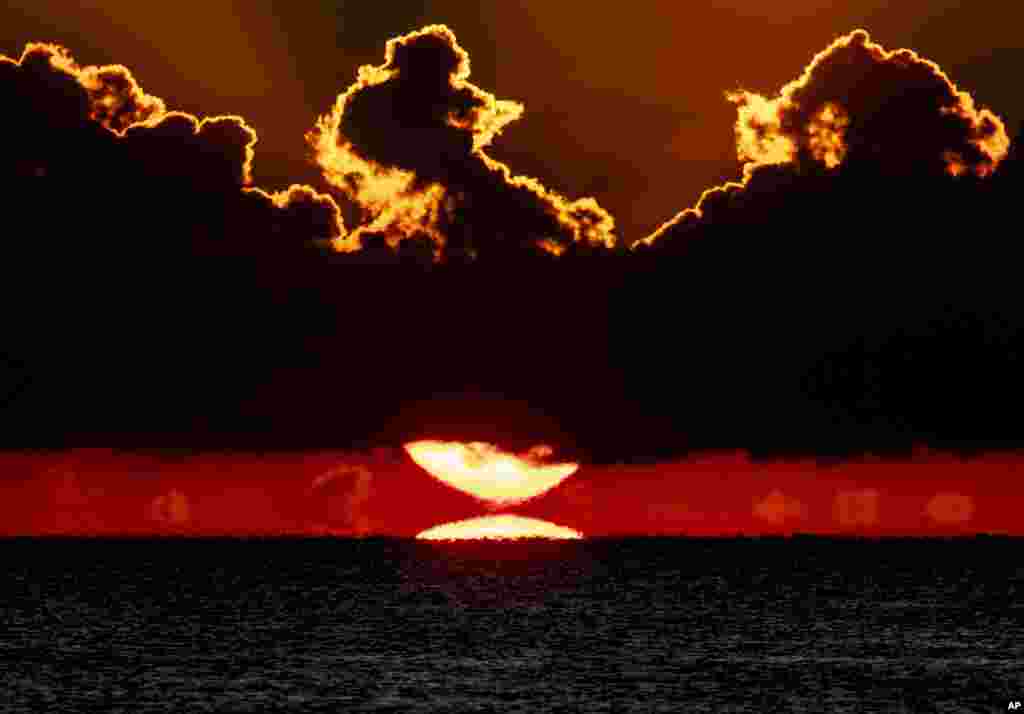 The sun rises over the Baltic Sea in Timmendorfer Strand, northern Germany.