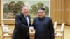 FILE - North Korean leader Kim Jong Un shakes hands with U.S. Secretary of State Mike Pompeo, May 9, 2018, released by North Korea's Korean Central News Agency (KCNA) in Pyongyang.