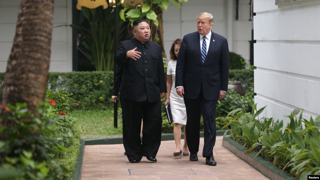 North Korea's leader Kim Jong Un and U.S. President Donald Trump talk in the garden of the Metropole hotel during the second North Korea-U.S. summit in Hanoi, Vietnam, Feb. 28, 2019.