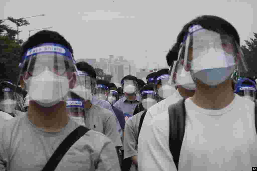 Interns and resident doctors attend a rally against the government medical policy in Seoul, South Korea.